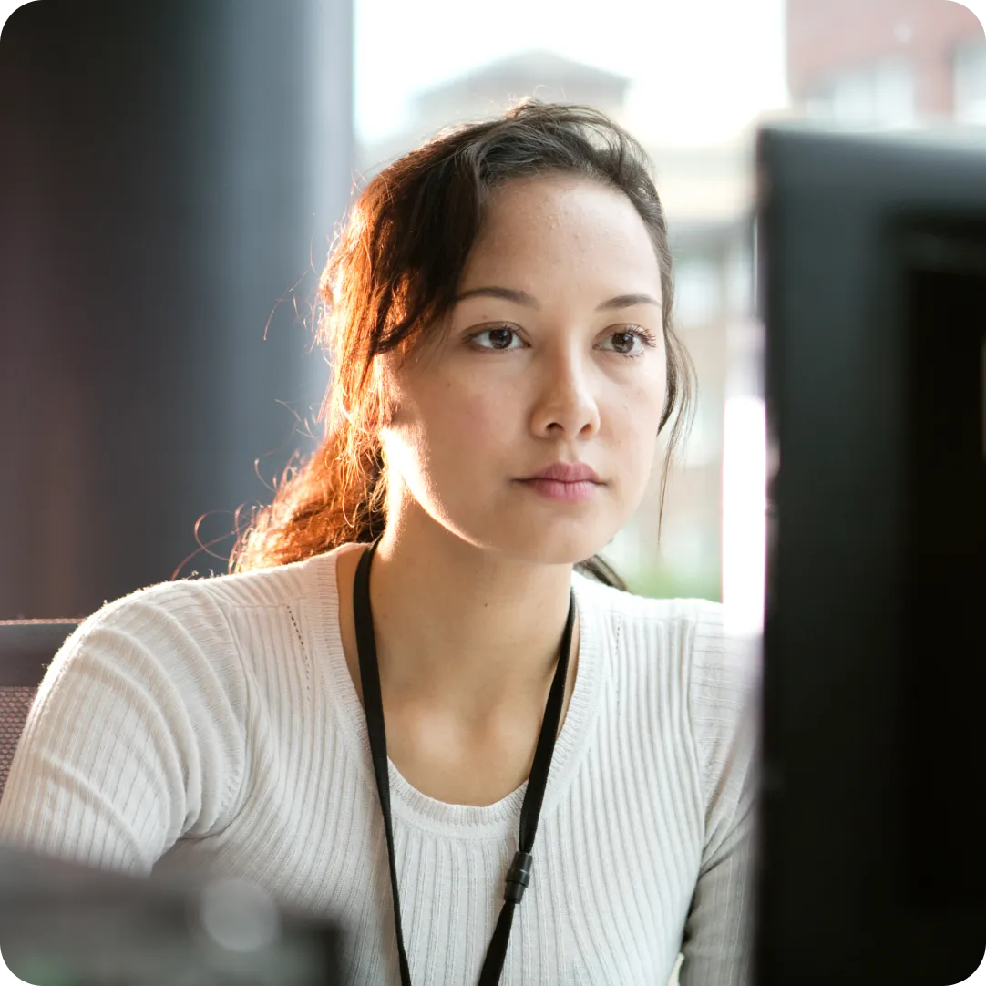 User looking at desktop monitor that has a full security framework with Duo 2FA.