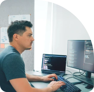 A person sitting in a datacenter environment.