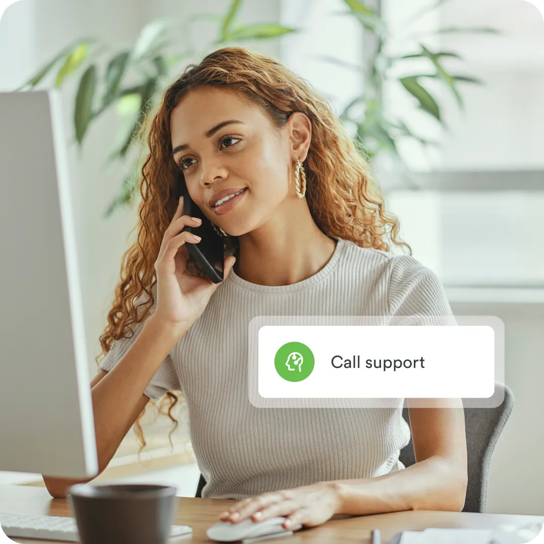 Administrator with a phone to their ear to contact Duo Support via the Duo Help Center