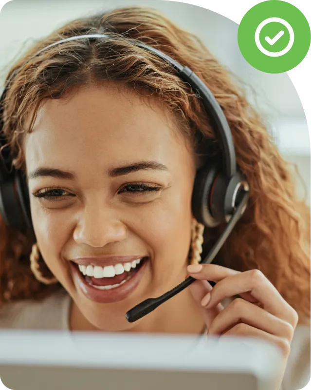 A woman smiling while discussing Duo support options with a customer.