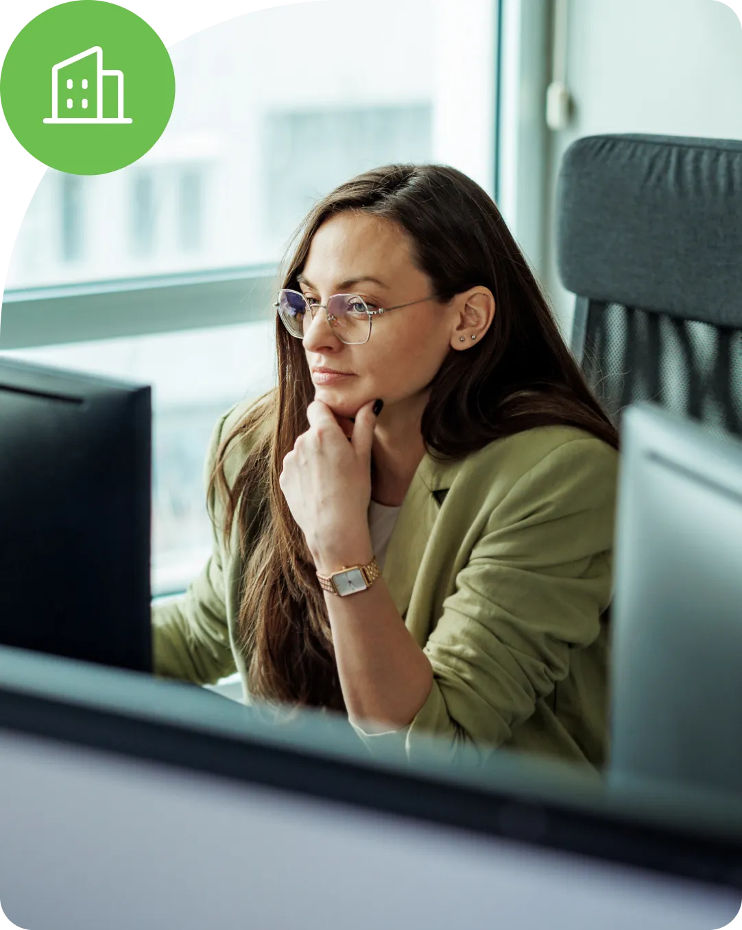 Professional looking at desktop computer to understand the enterprise identity security solutions with Duo.