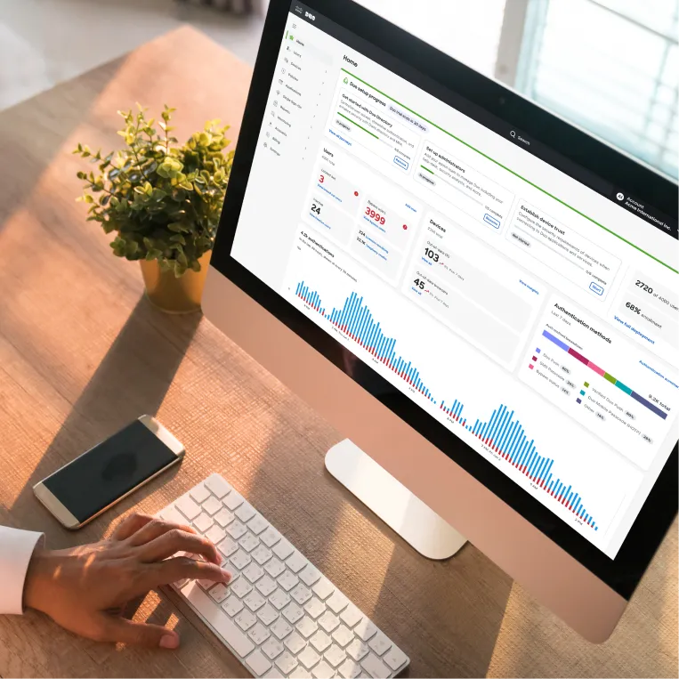 Person using an desktop with a data dashboard on screen.