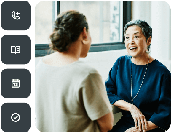 Women in an office talking to each other. Left of photo are button icons for mobile phone functions.